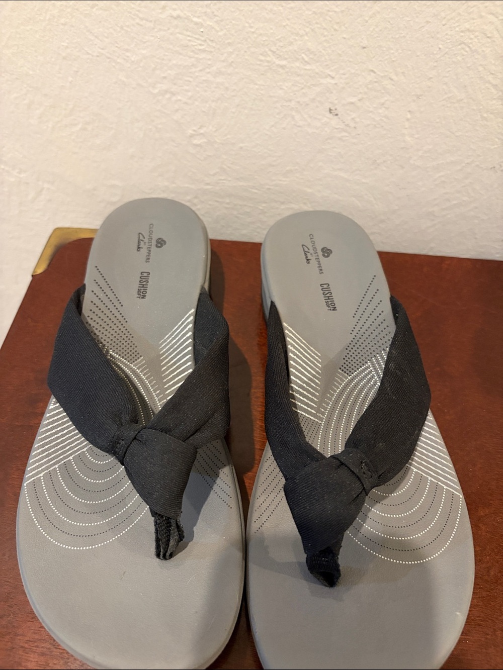Clarks Cloud Steppers Sandals with Black Fabric Knotted Straps.